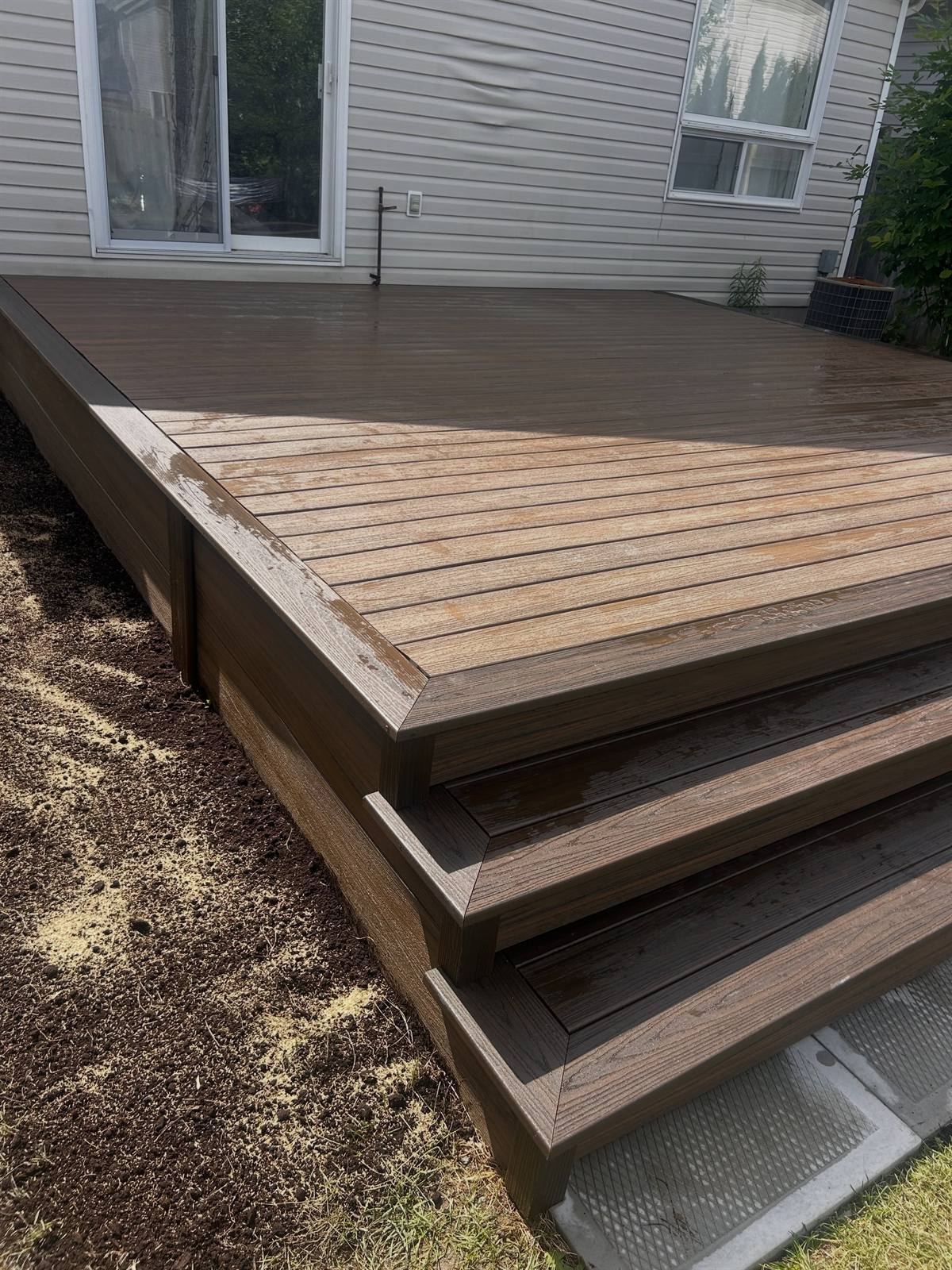 Composite deck with wide steps in Kingston, Ontario