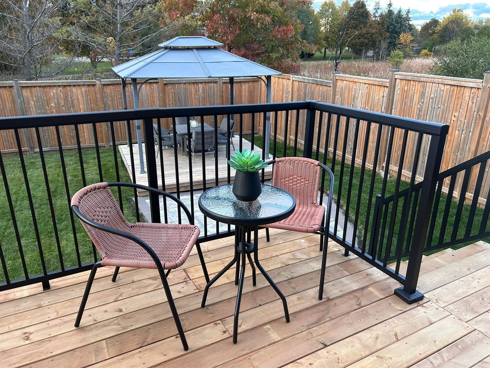Composite deck with aluminum railing and gazebo in Kingston, Ontario