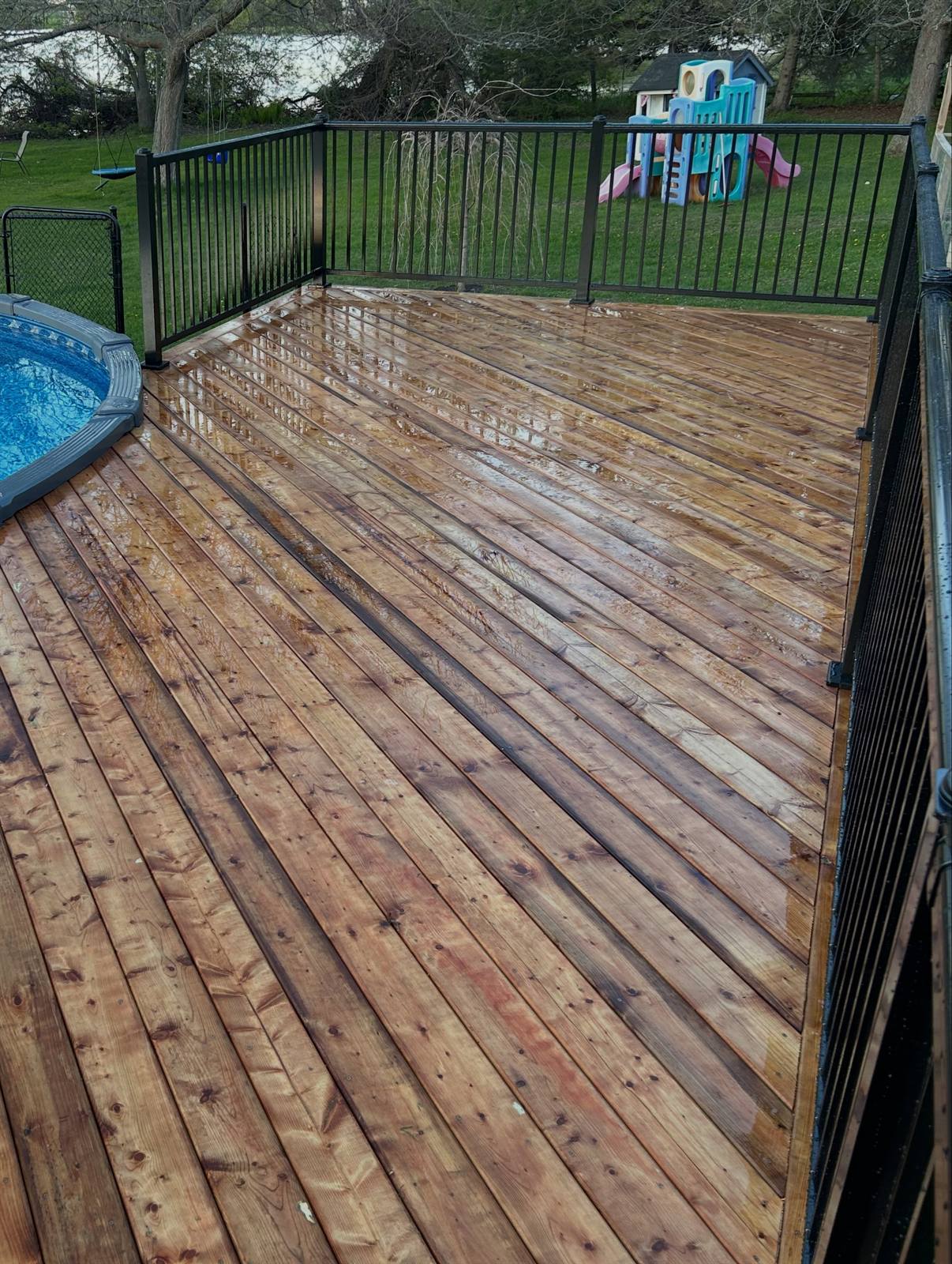 Wood pool deck with aluminum railing in Kingston, Ontario