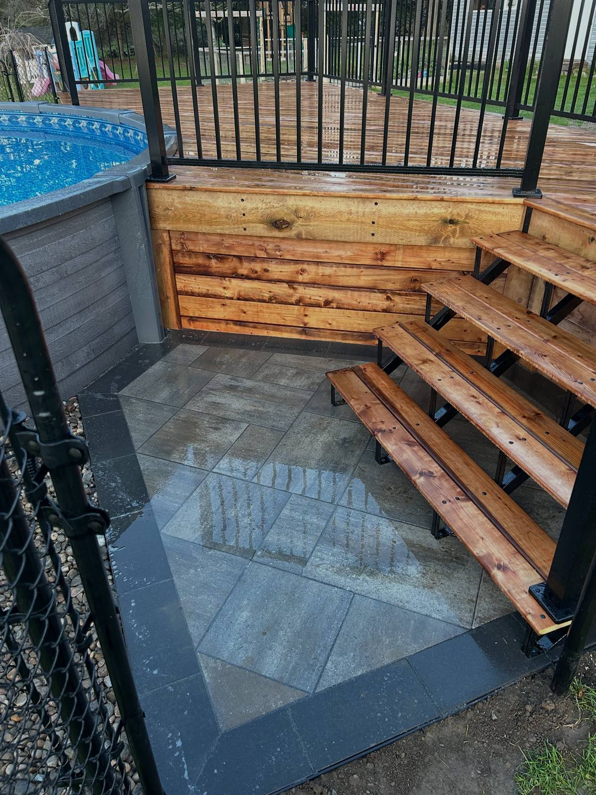 Pool deck with cedar skirt and paver landing in Kingston, Ontario