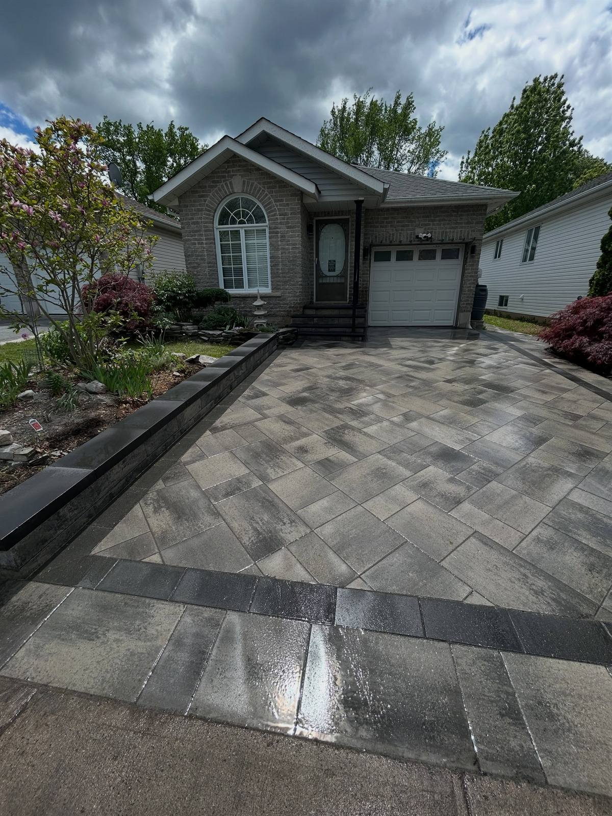 Interlock driveway at a brick bungalow in Kingston, Ontario