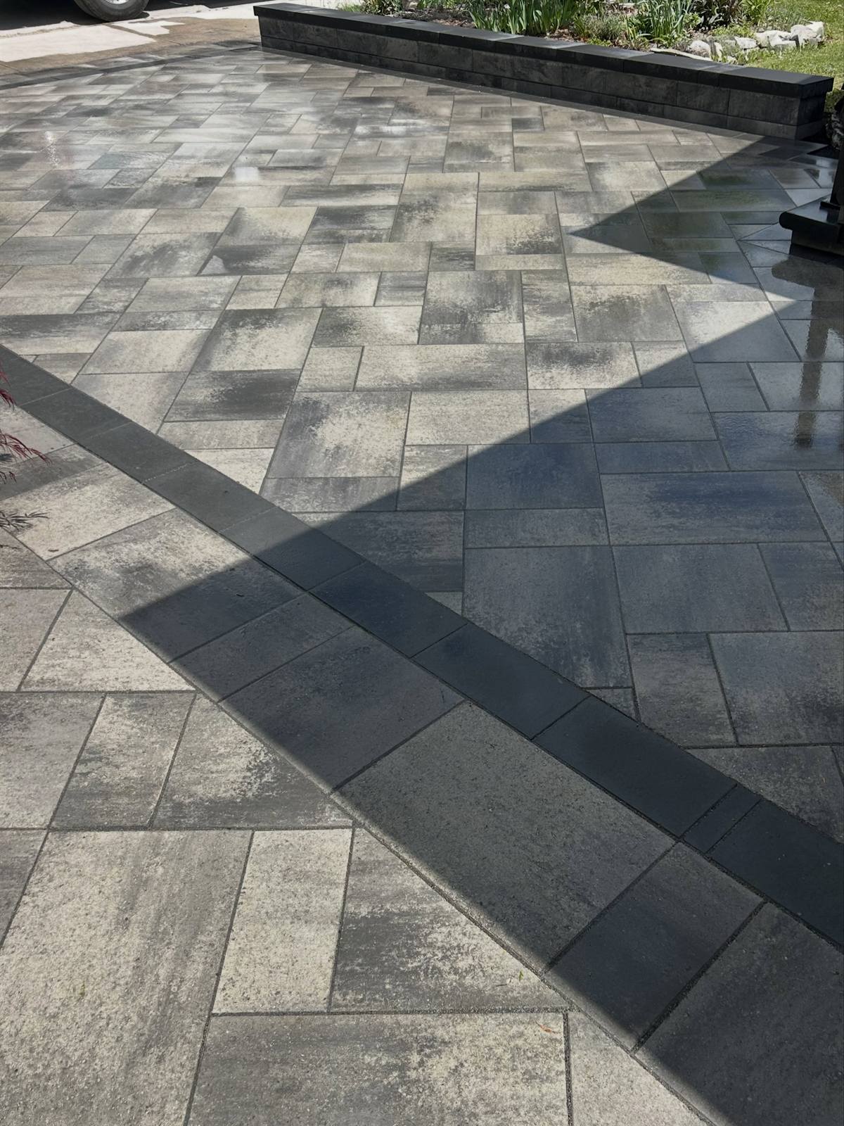 Interlock driveway with raised garden wall in Kingston, Ontario