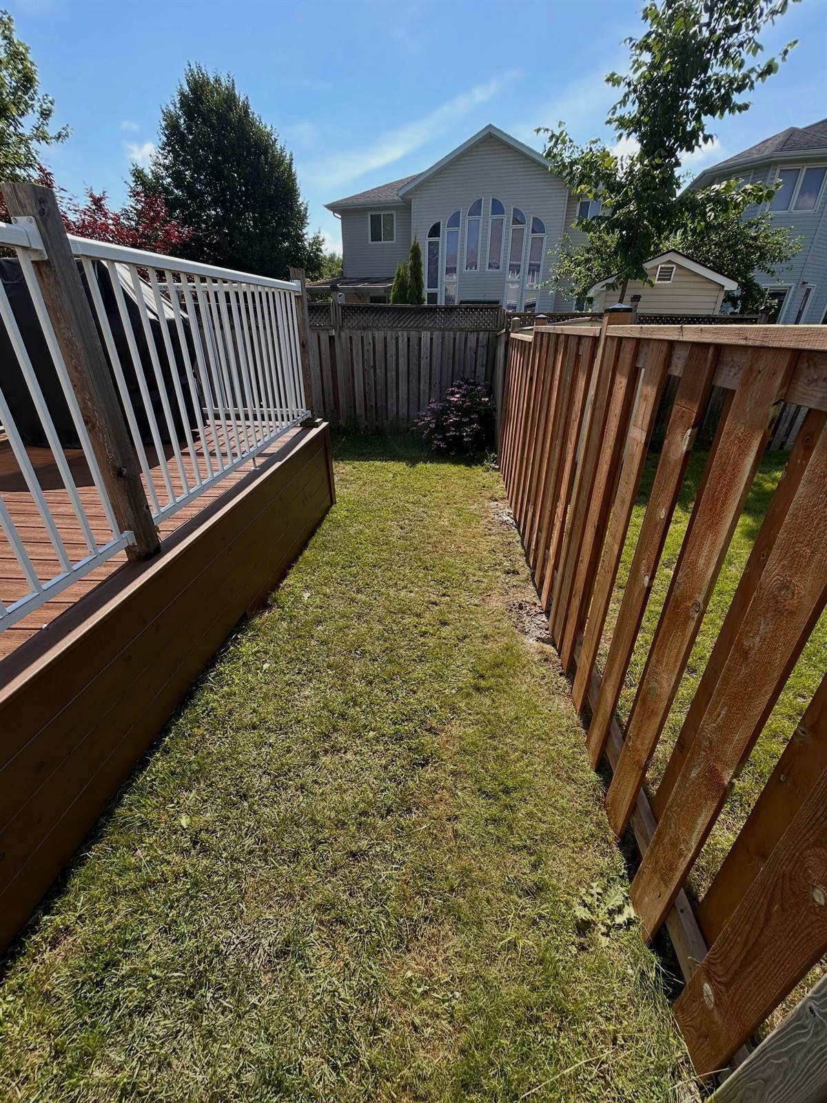 Charcoal stone patio with contrasting border by Gonzo Construction, Kingston area